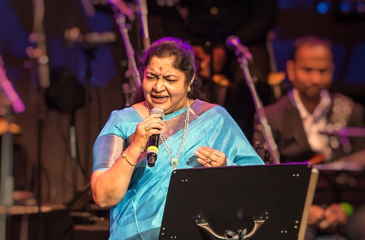 K. S. Chitra singing on stage with the band behind her